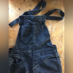 Black Levi, stretchy straight leg overalls. Slim bib.